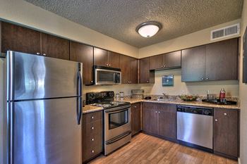Kitchen with Stainless Steel Appliances Refrigerator Microwave Oven Stove and Dishwasher at Fountains of Fair Oaks, Fair Oaks